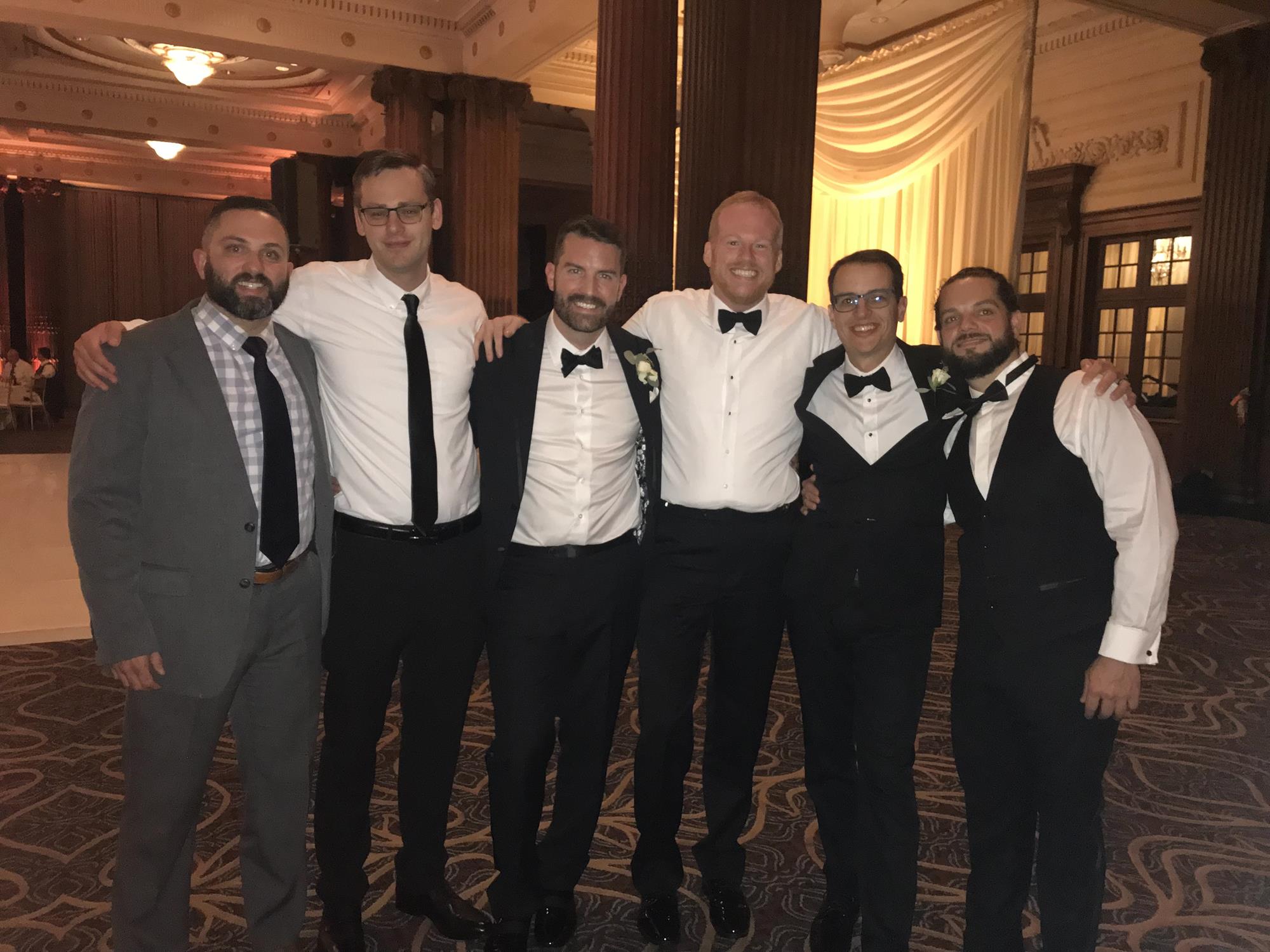 Planamento (left) with his college roommates at a wedding.